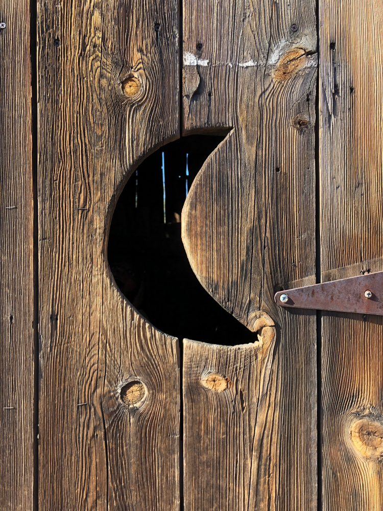 Crescent-shaped cut-out on an outhouse