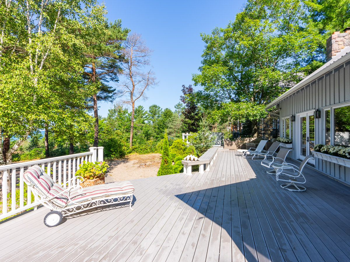 A large back deck with lots of ceiling.