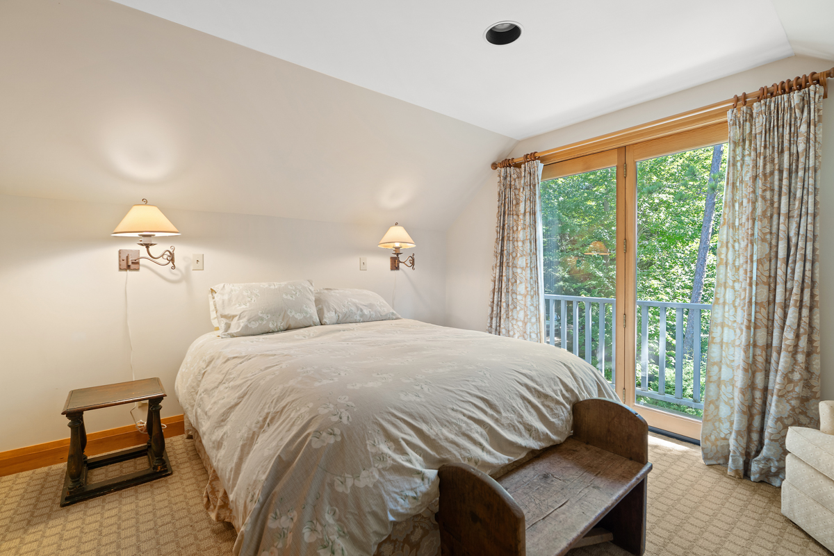 A bright bedroom with a big bed.
