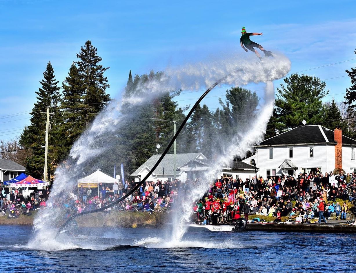 two people playing with a water jet pack