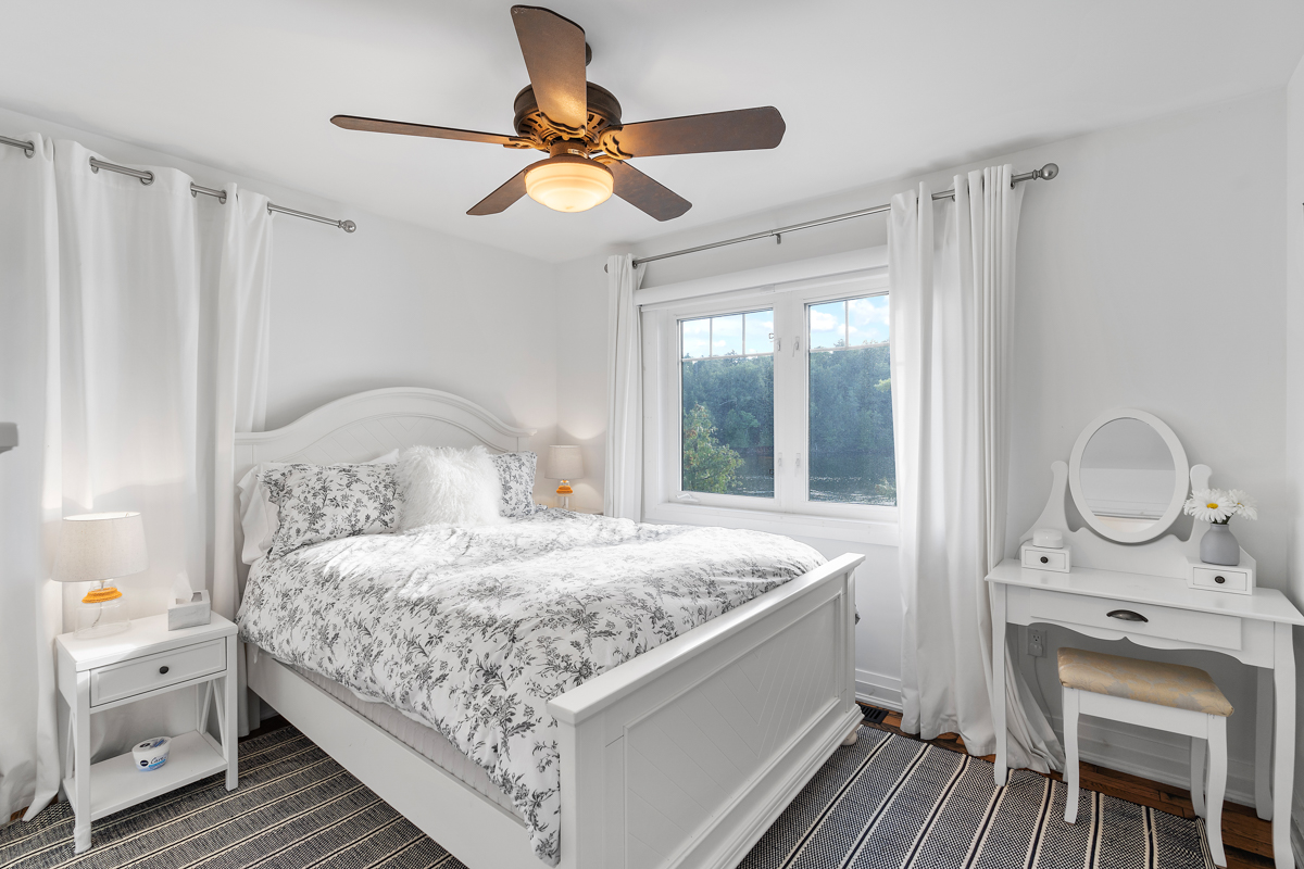 A bright bedroom with a big bed.