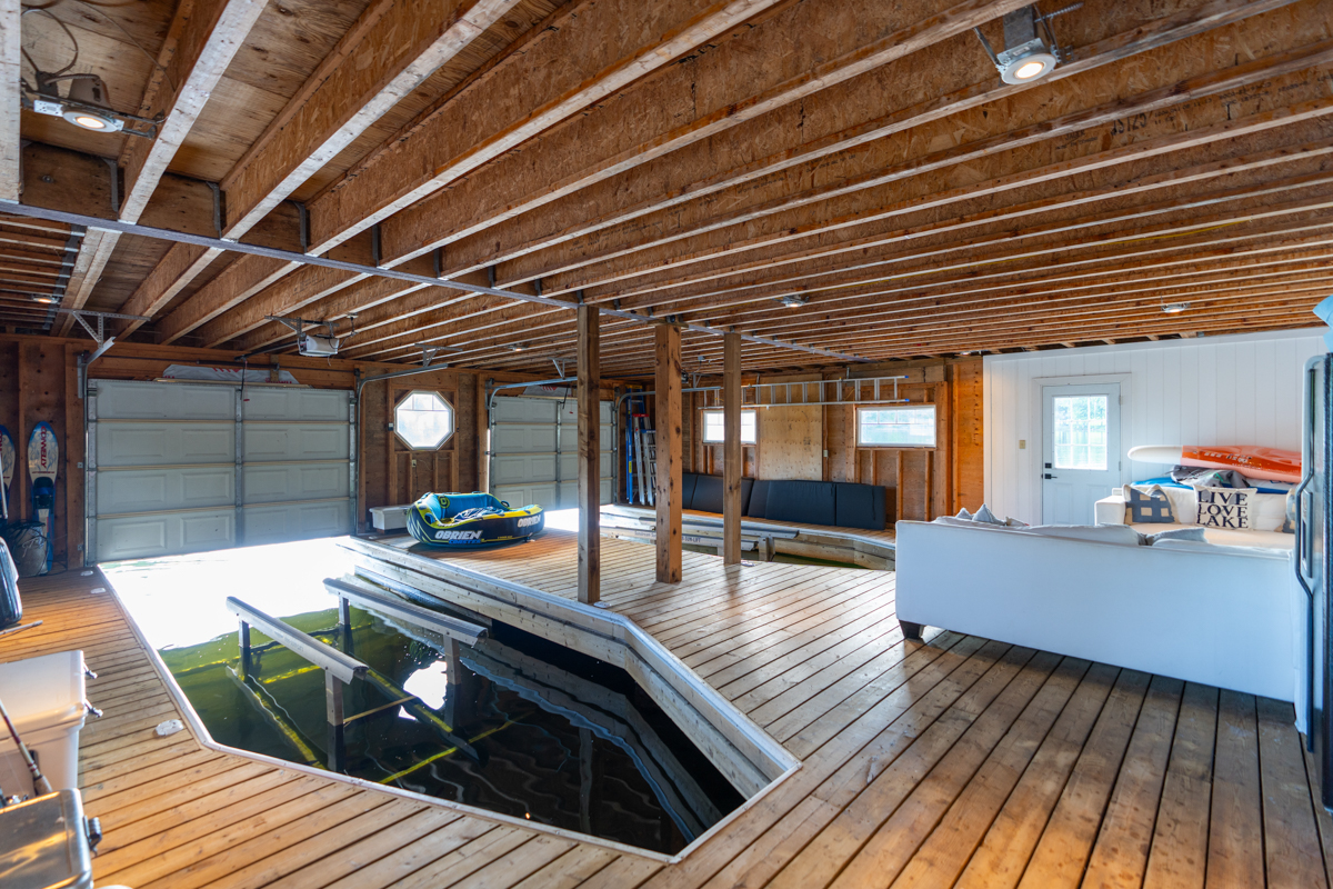 Interior of a large, two-slip boathouse.