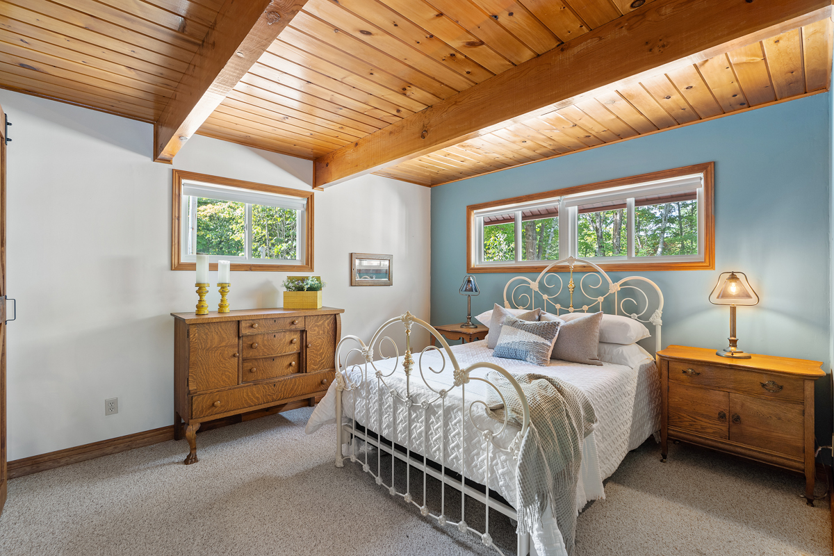 A bright bedroom with a large bed.
