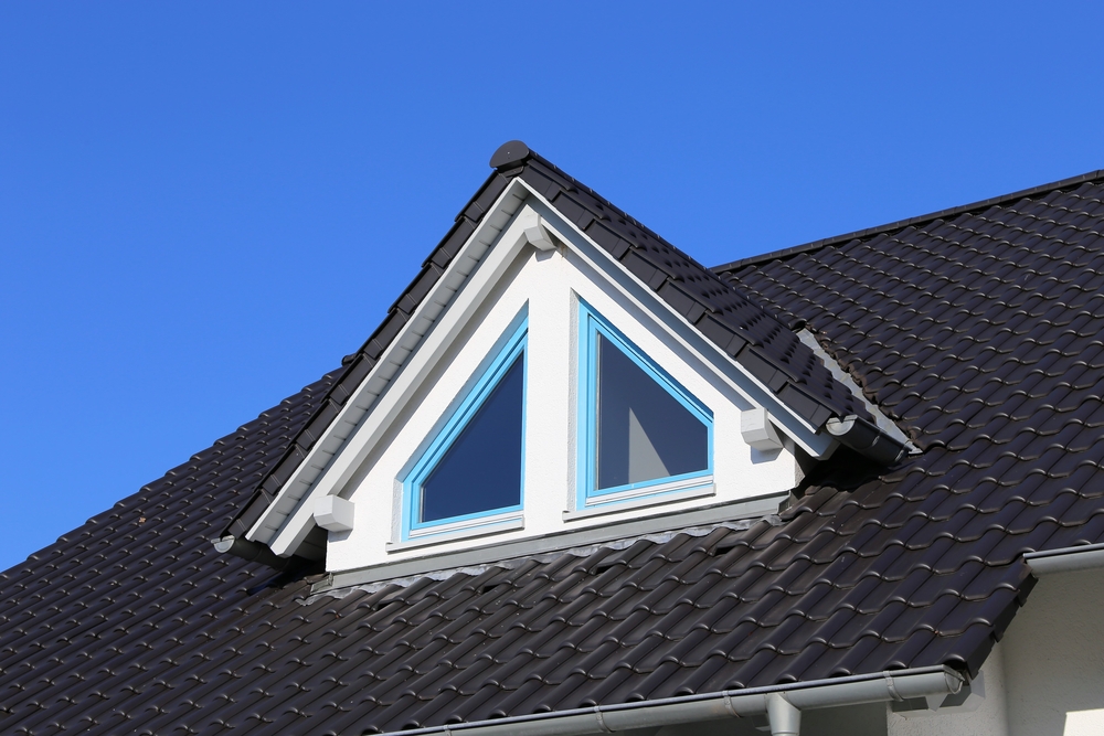 A dormer window on a tiled roof
