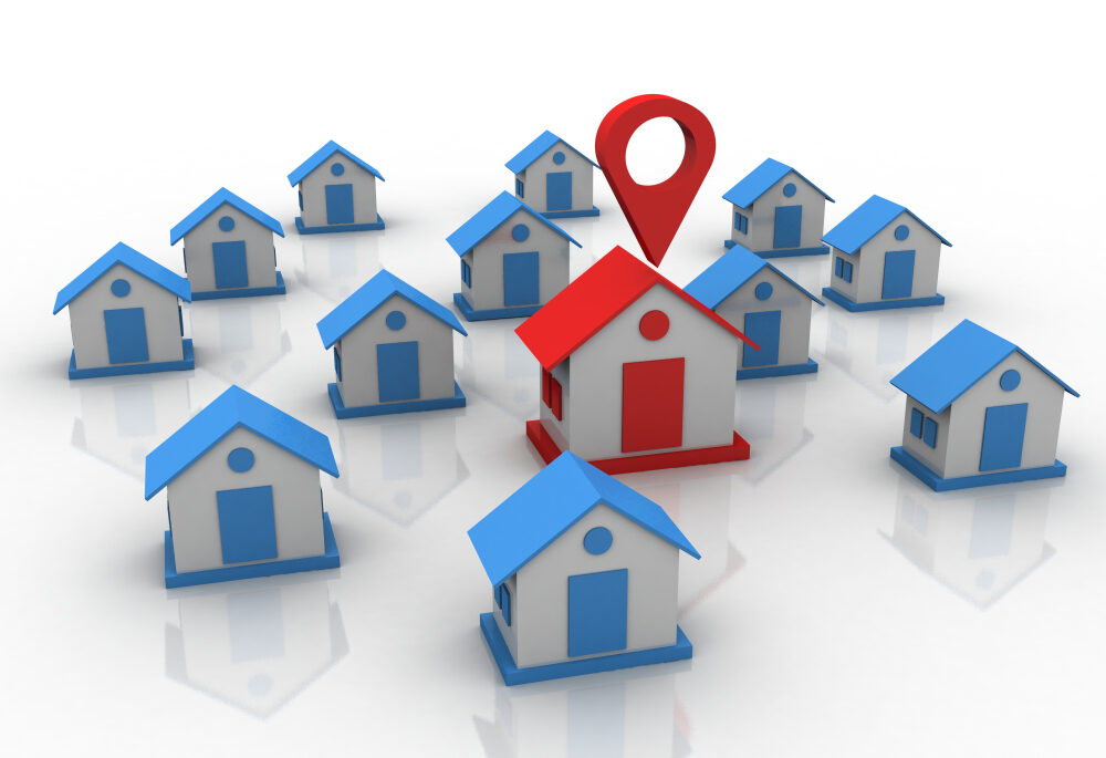 blue houses and one big red house in the middle