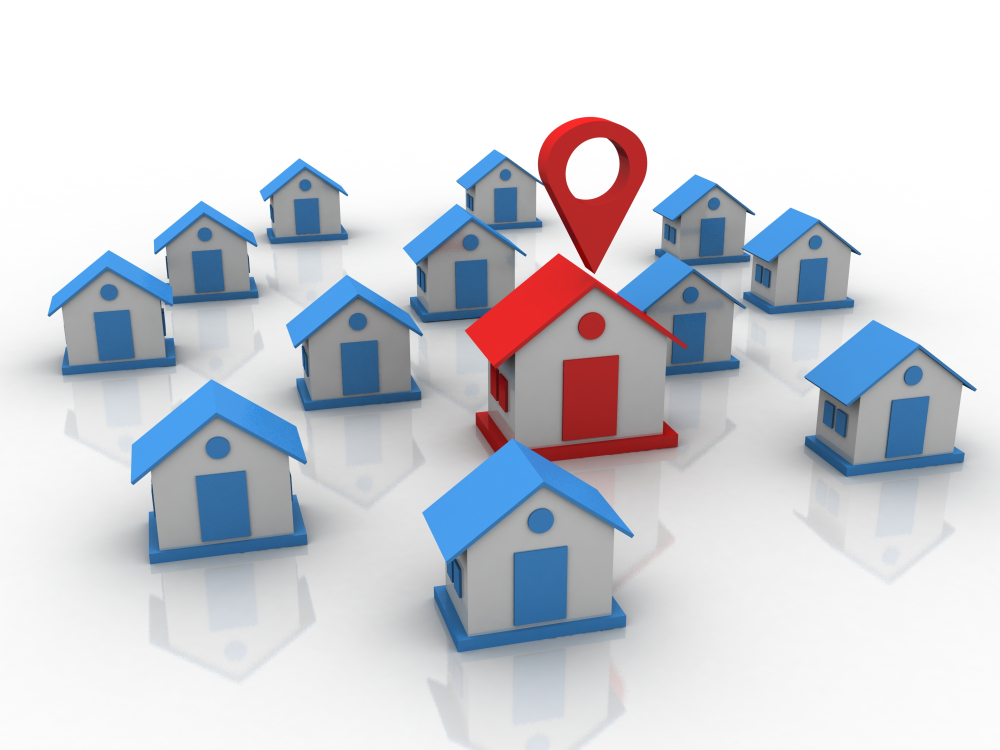 blue houses and one big red house in the middle