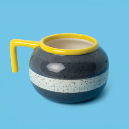 mug that looks like a curling rock with a yellow lip and handle