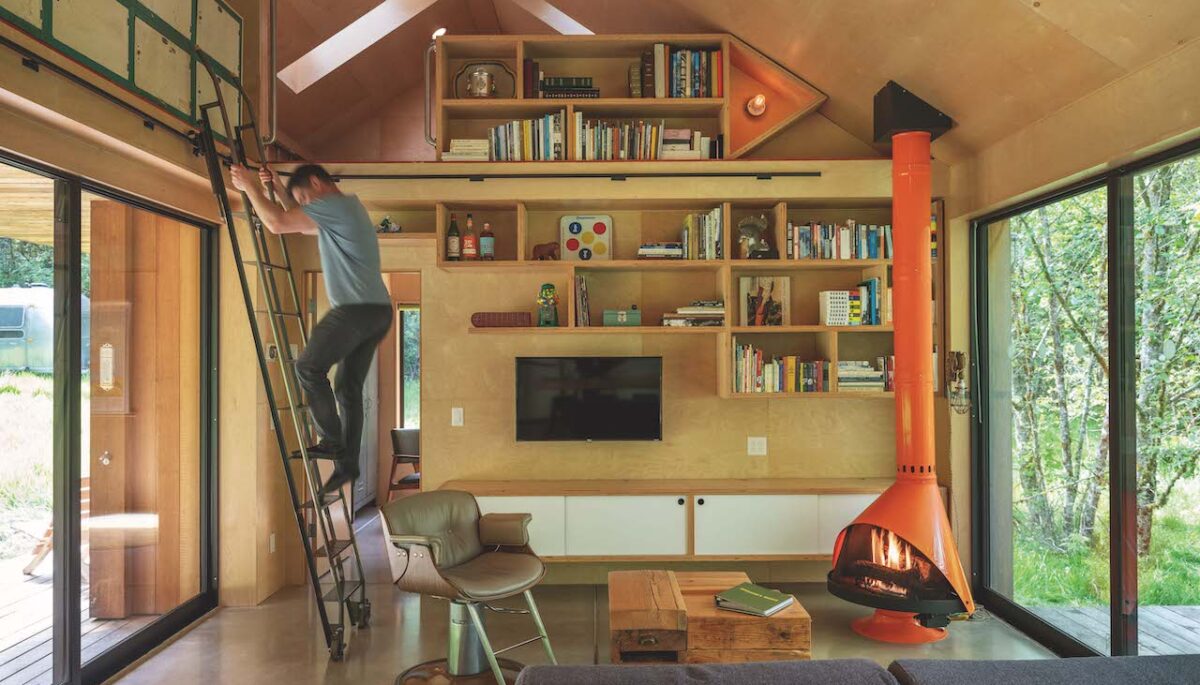 A photo of an Oregon retreat with plenty of built-in storage including a rolling ladder