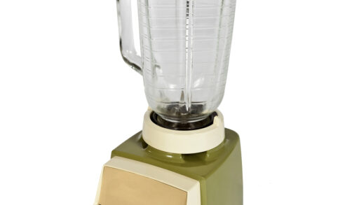 A vintage blender against a white background