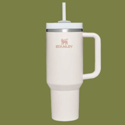 pink tumbler cup against a green background