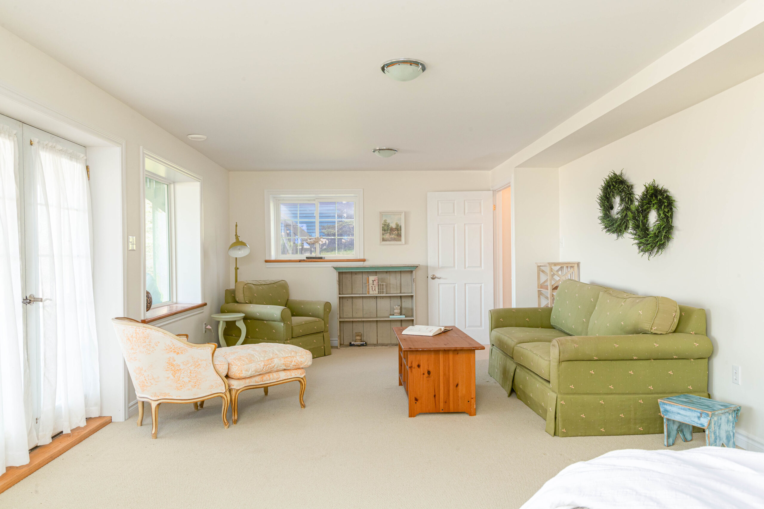 a room with two green couches