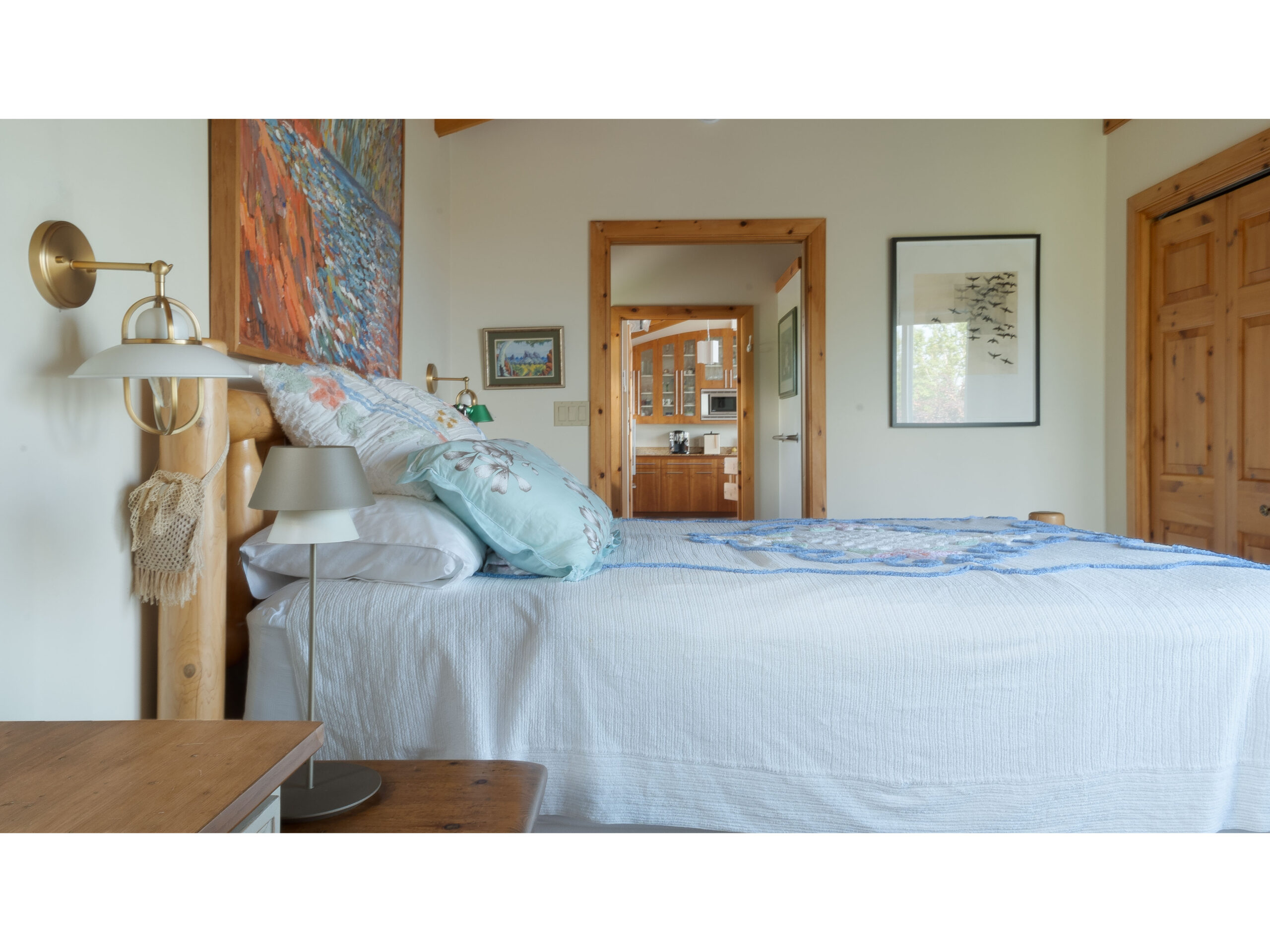 A bright bedroom with a big bed.