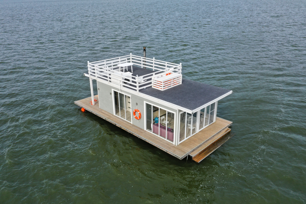 A floating accommodation floats in the water.