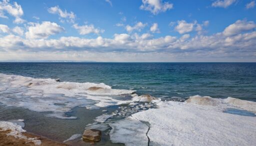 Drone shot of Georgian Bay Ice Pack Breaking Up and Melting in February when unseasonably warm