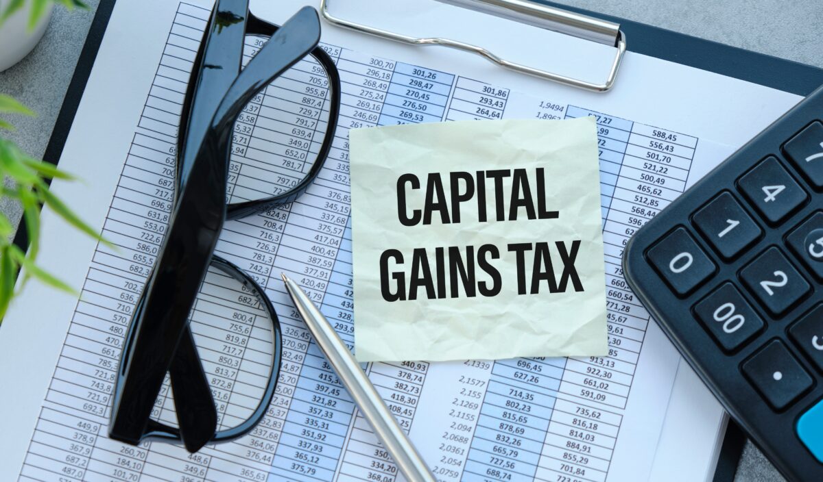 capital gains tax written on a sticky note
