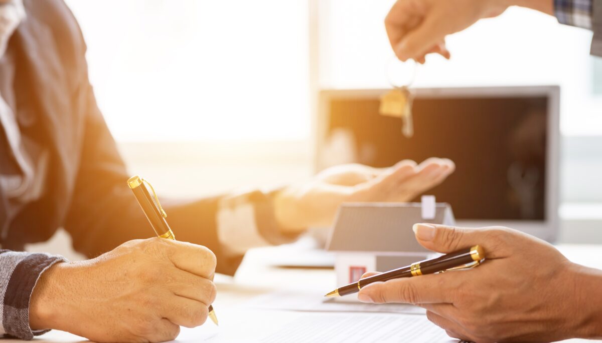 two hands and paperwork