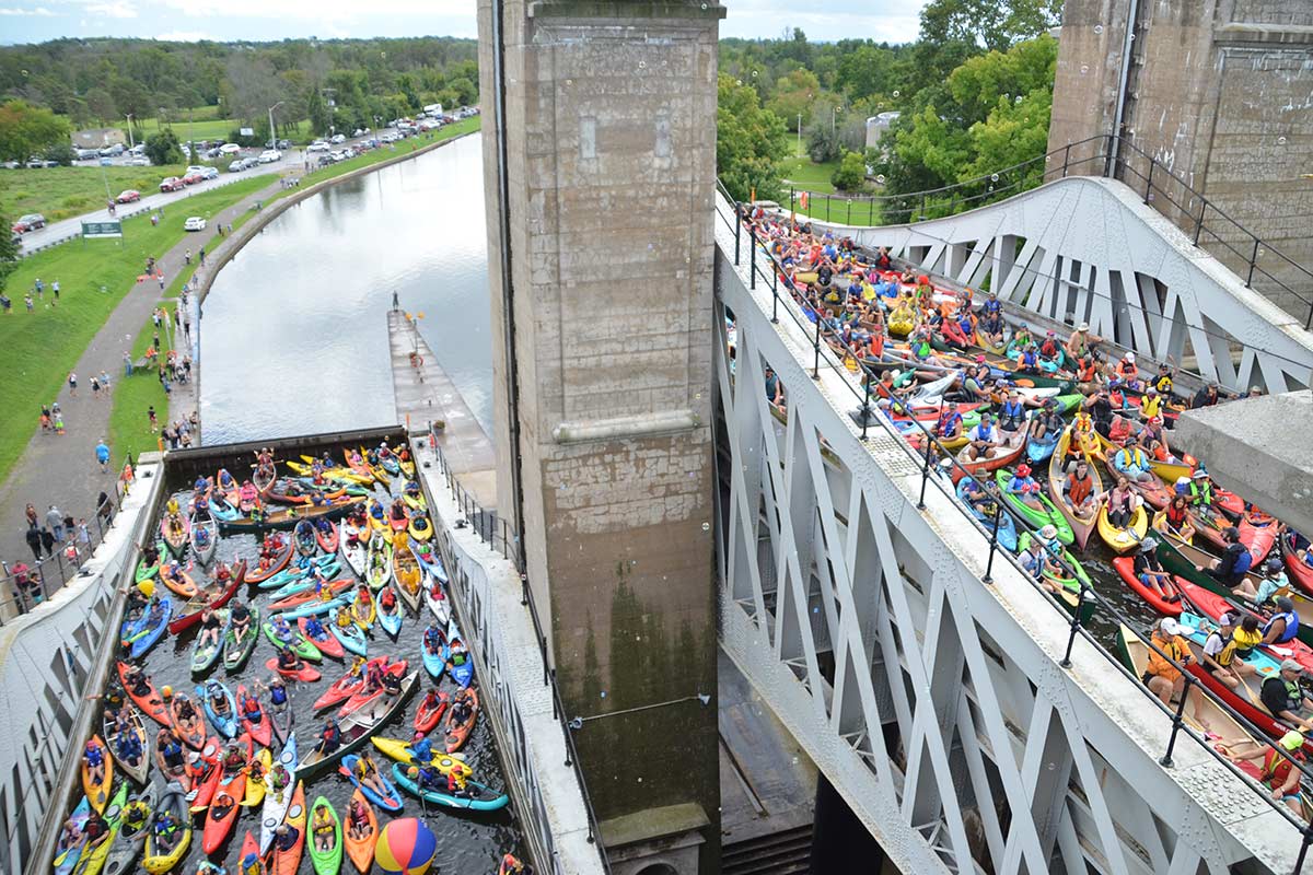 people in kayaks and canoes on the trent-severn waterway in peterborough