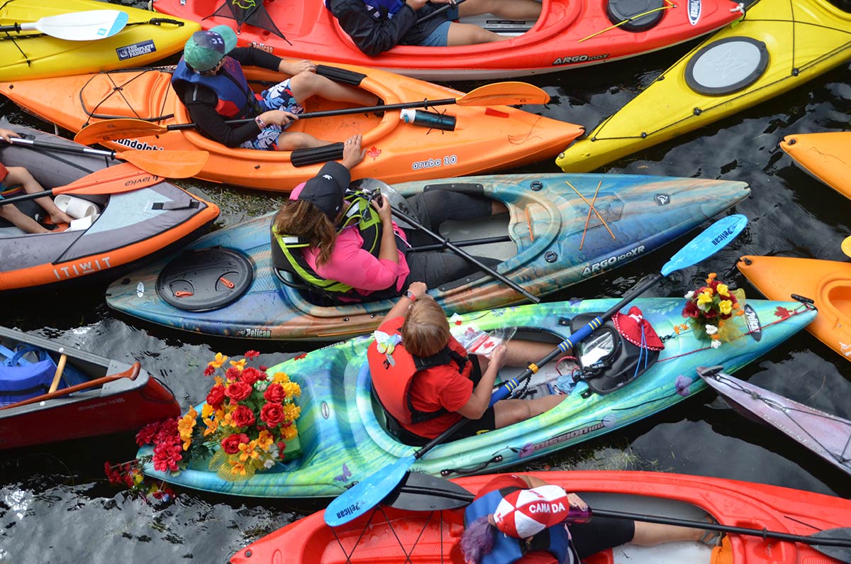 people in kayaks and canoes on the trent-severn waterway in peterborough
