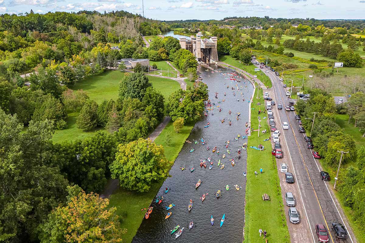 people in kayaks and canoes on the trent-severn waterway in peterborough
