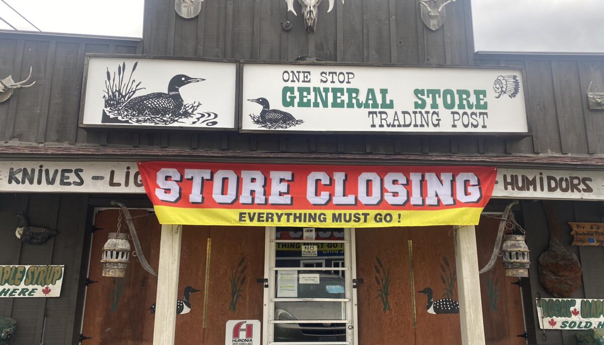 Store closing sign on the one stop general store in Huntsville, Ont.