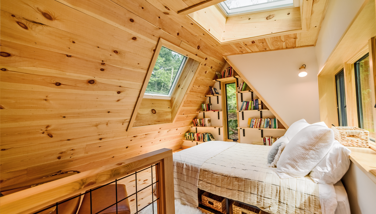 Photo of a bedroom with a skylight above the bed