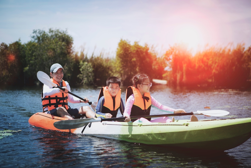 family in a canoe wearing a life jacket