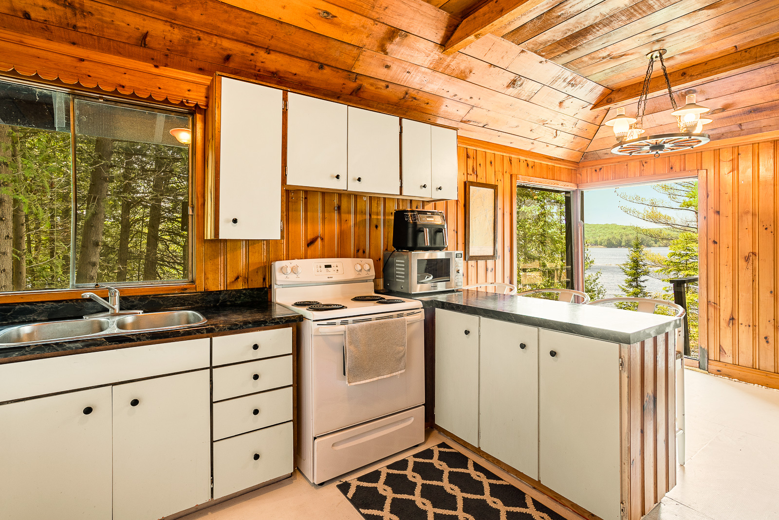 White lined kitchen cabinets with a white stove