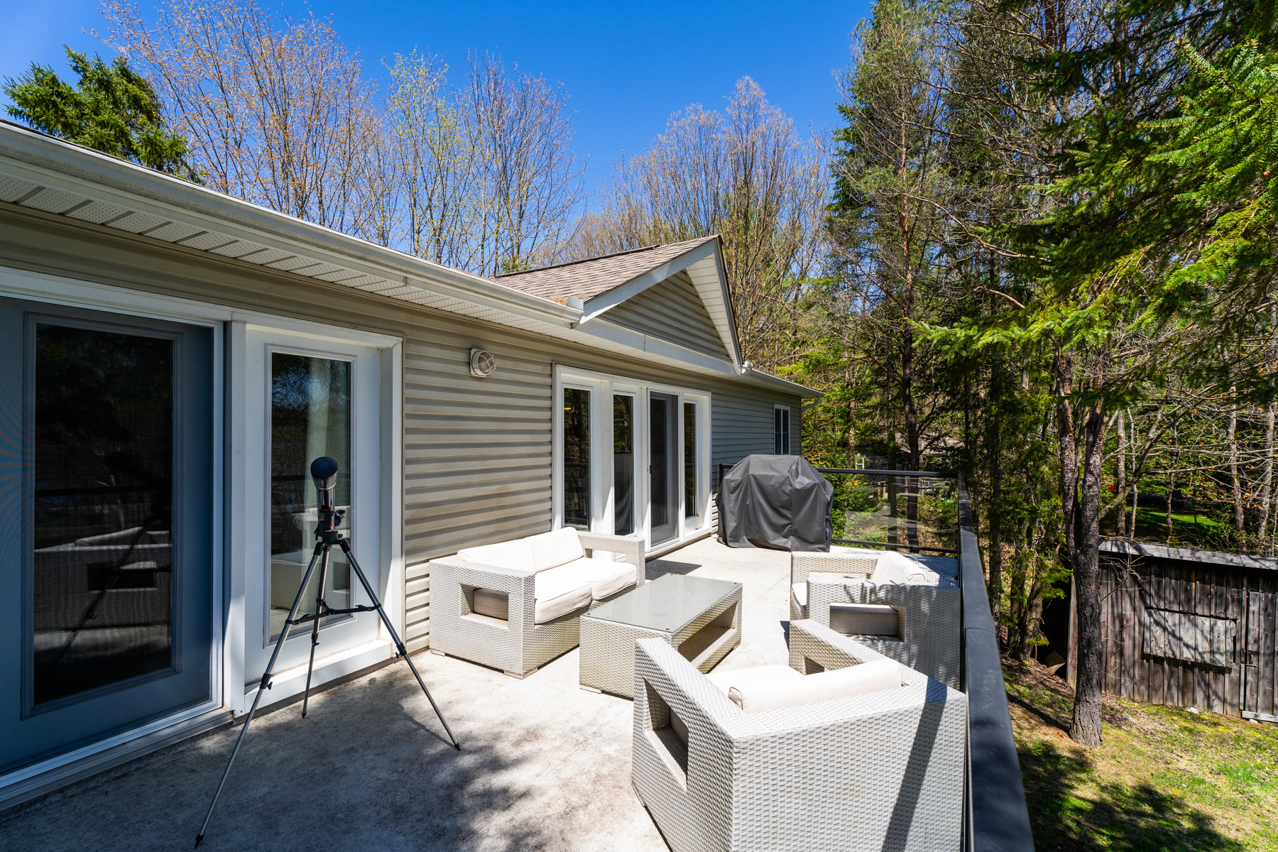 White patio furniture on the back deck
