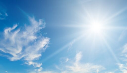 Blue sky with sun and clouds