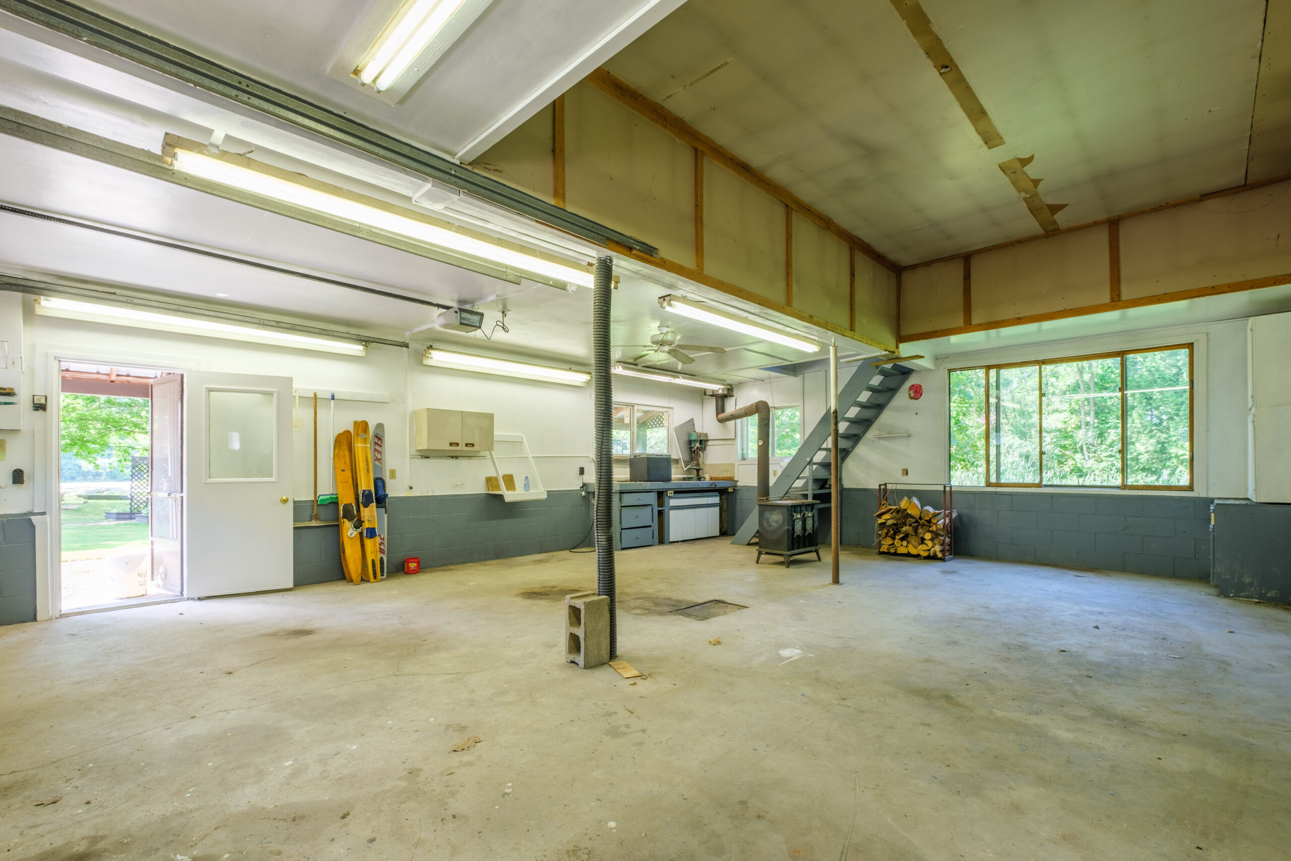 Unfinished empty garage space with concrete floors