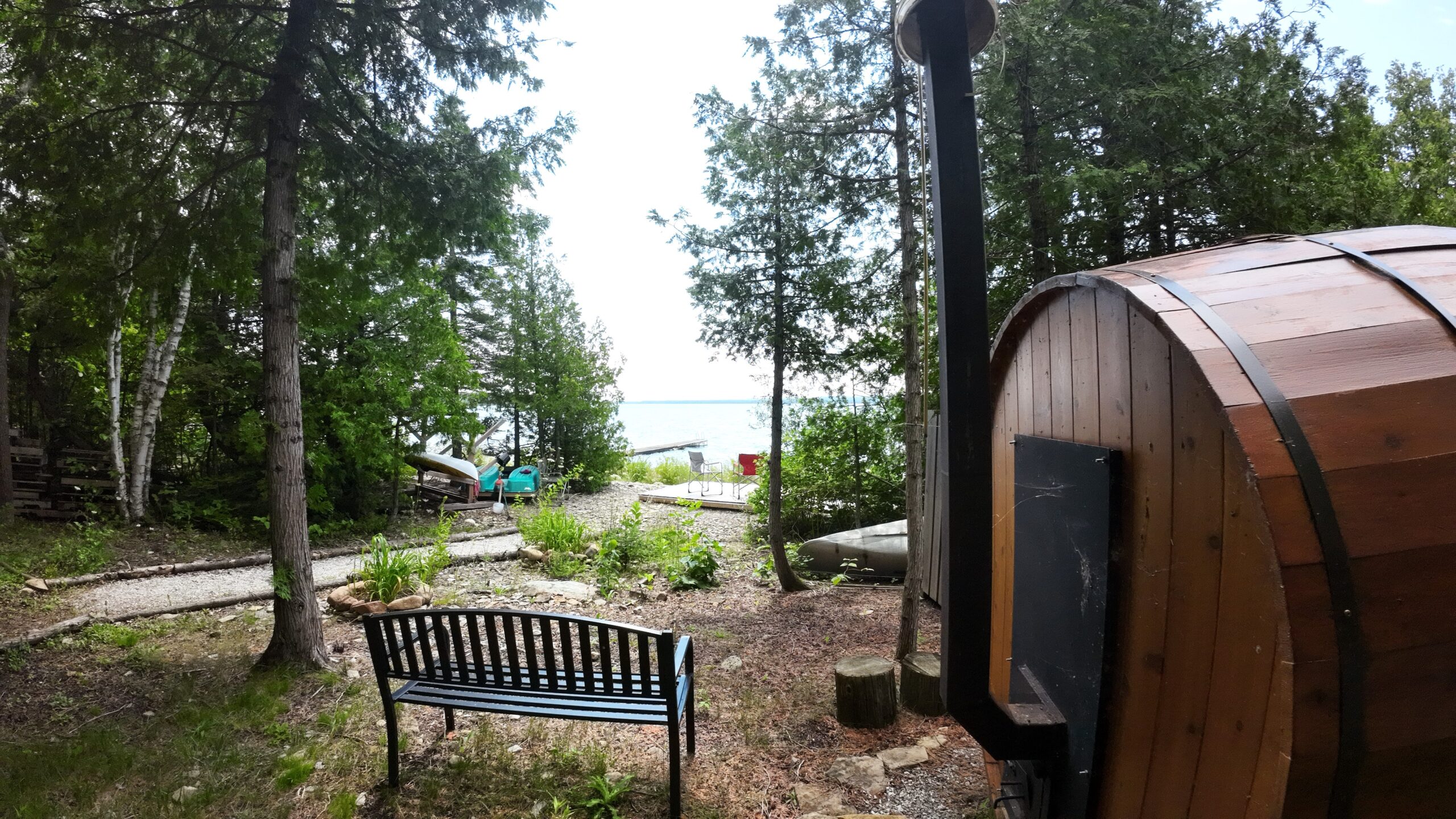 a wooden sauna and a bench