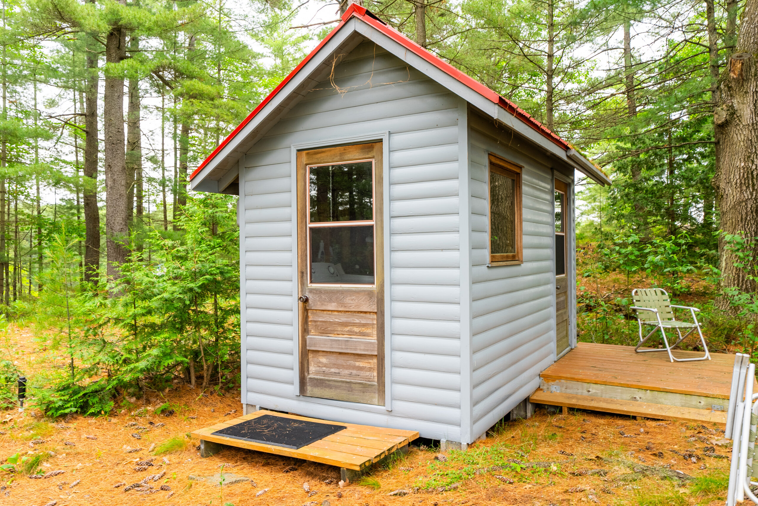 A small light grey building