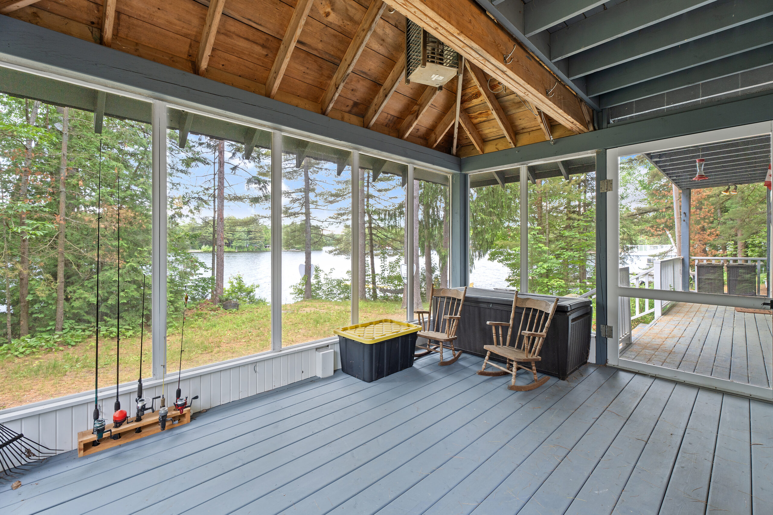 A bright sunroom that faces teh lake