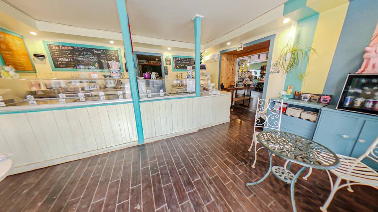 A wide space with an ice cream parlour counter