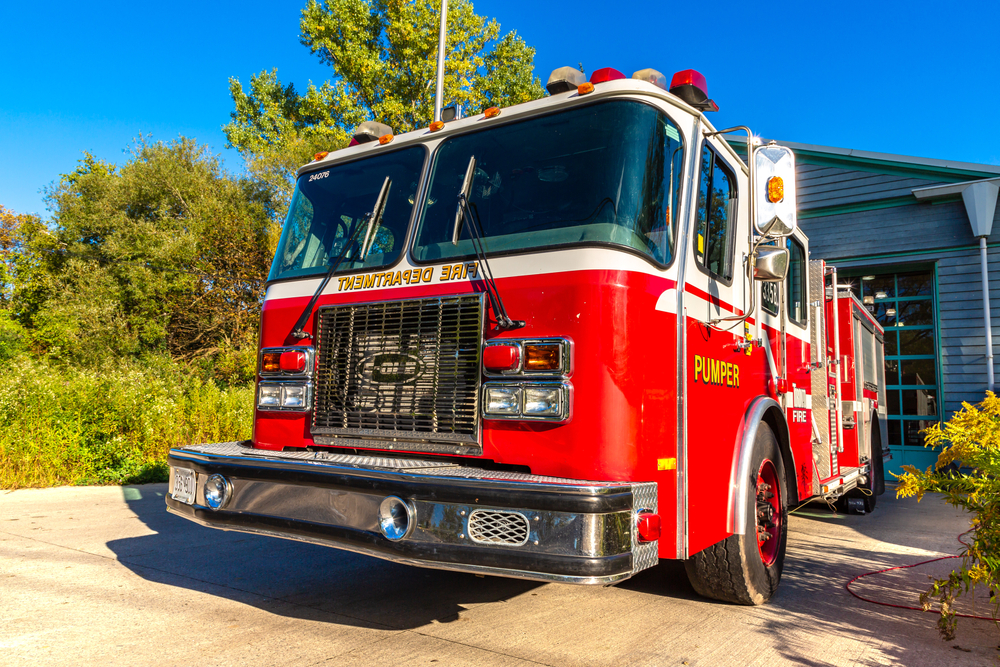 Fire truck at a fire station on a sunny day, Ontario, Canada