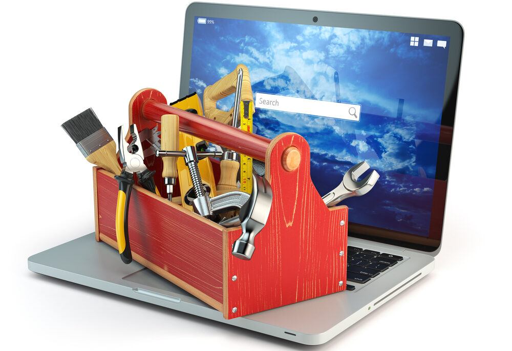 A toolbox sitting on an open laptop computer