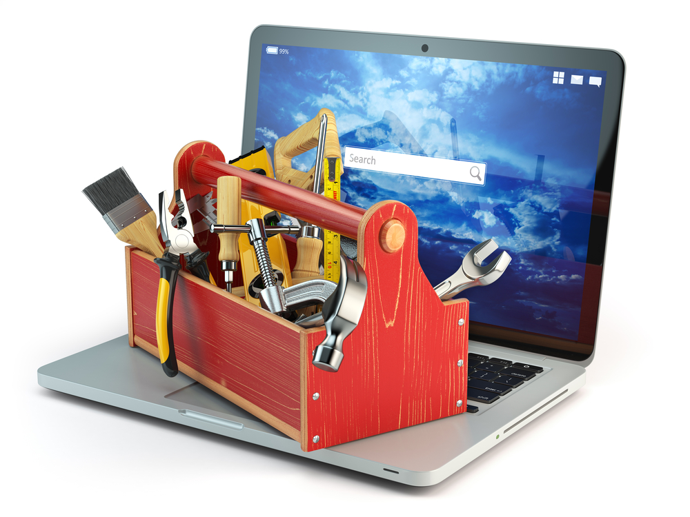 A toolbox sitting on an open laptop computer