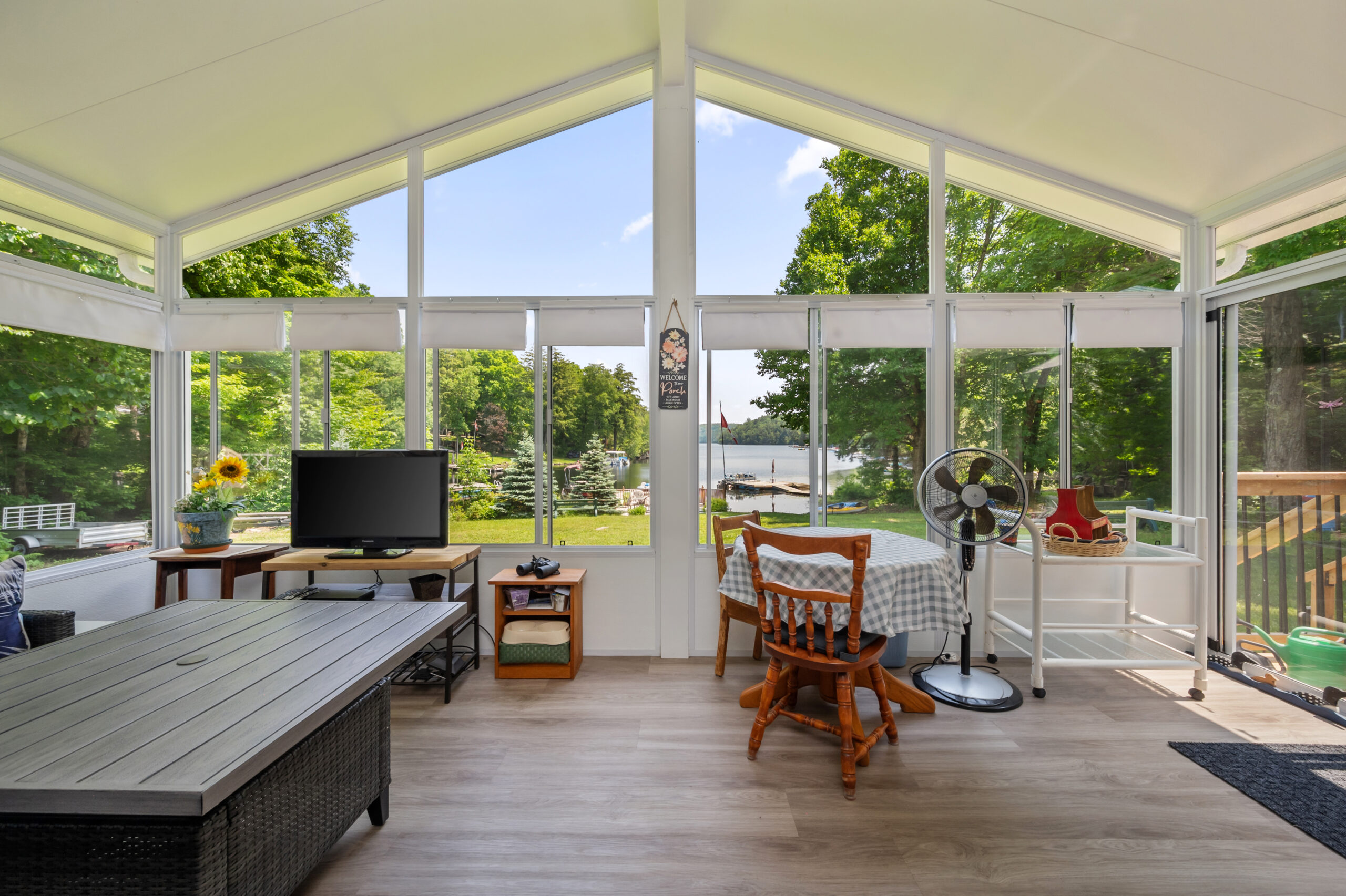 A glass wall that comes up to a point on the ceiling.