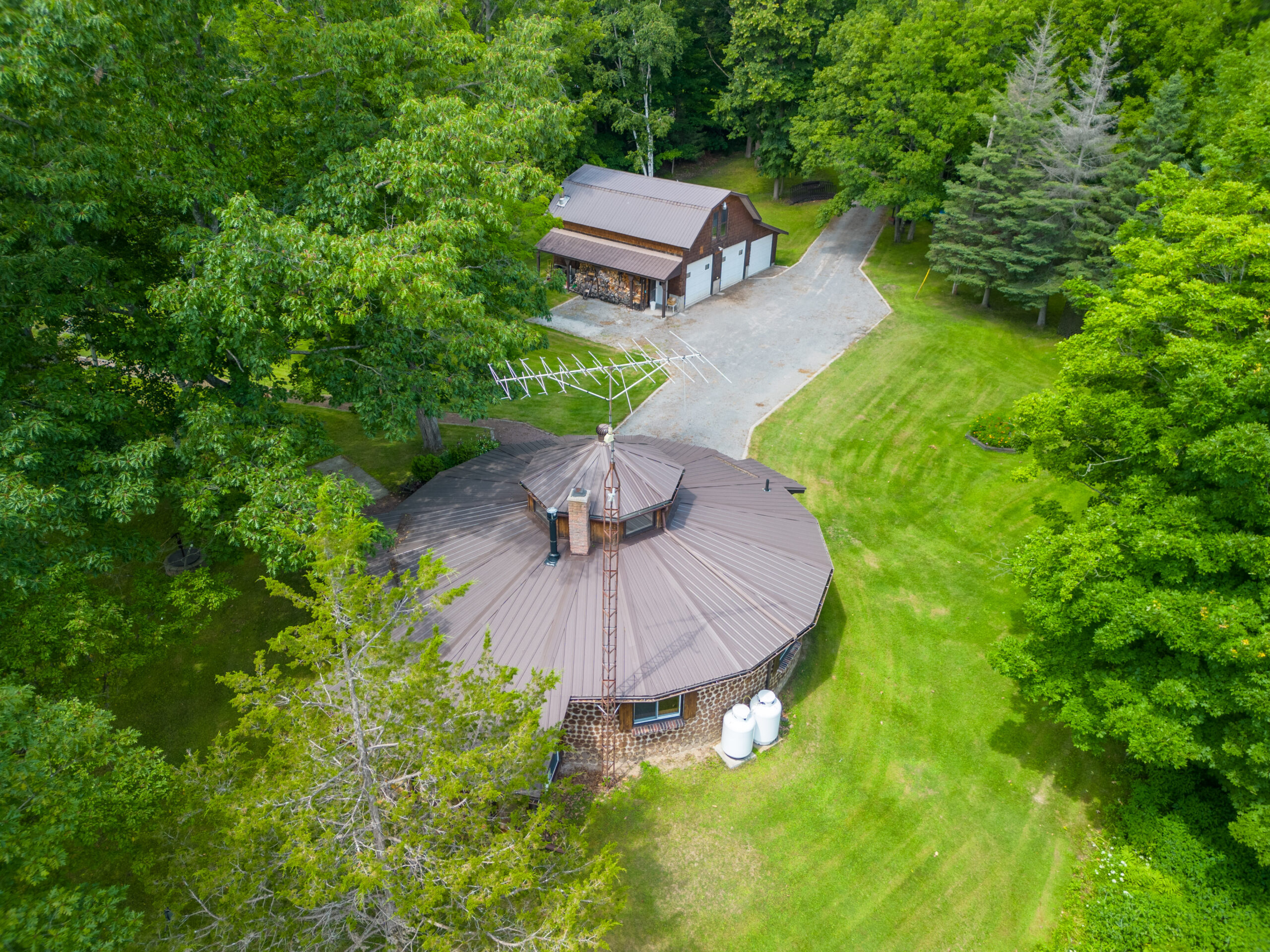 a round cottage with a boathouse