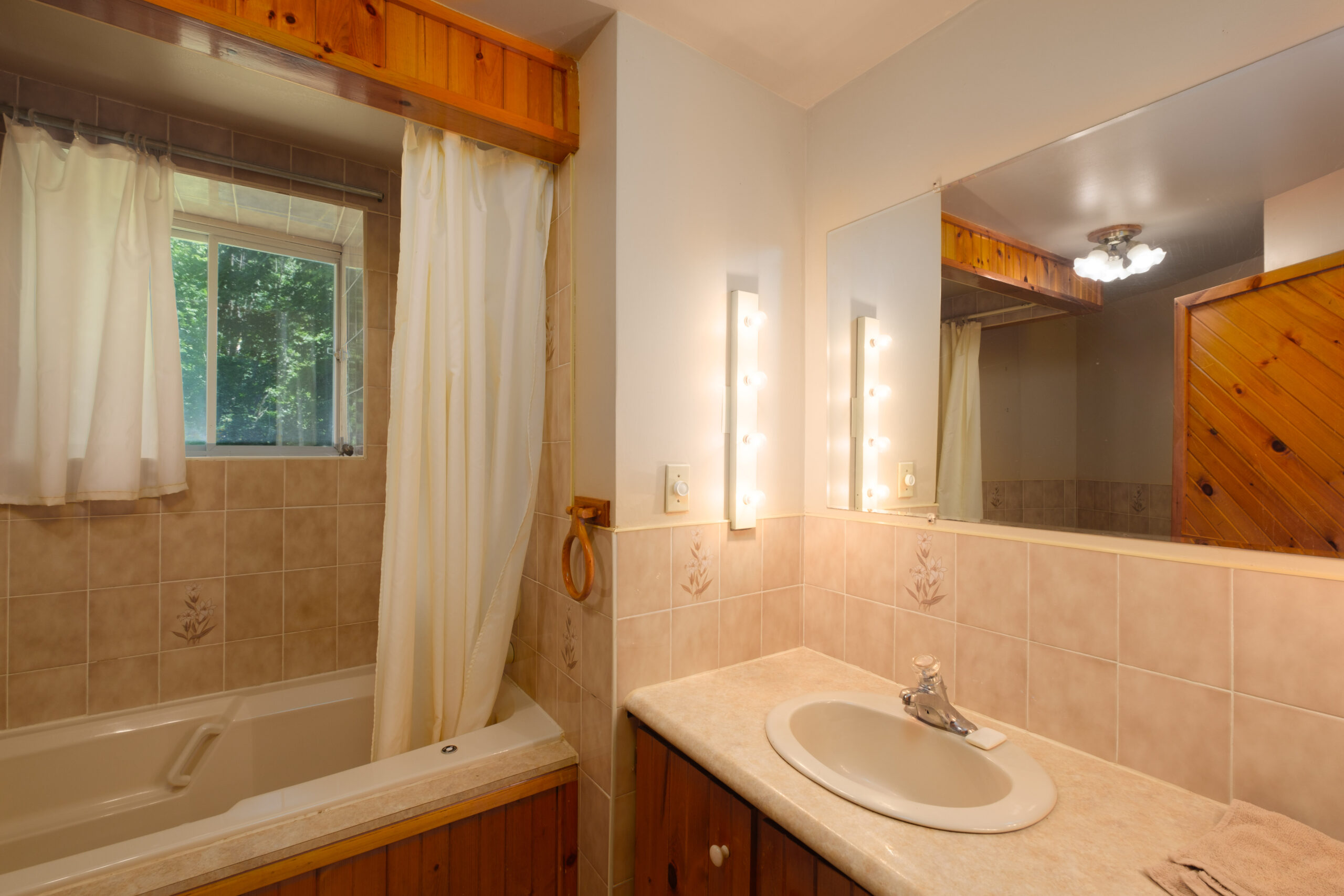 a bathroom with a sink and shower