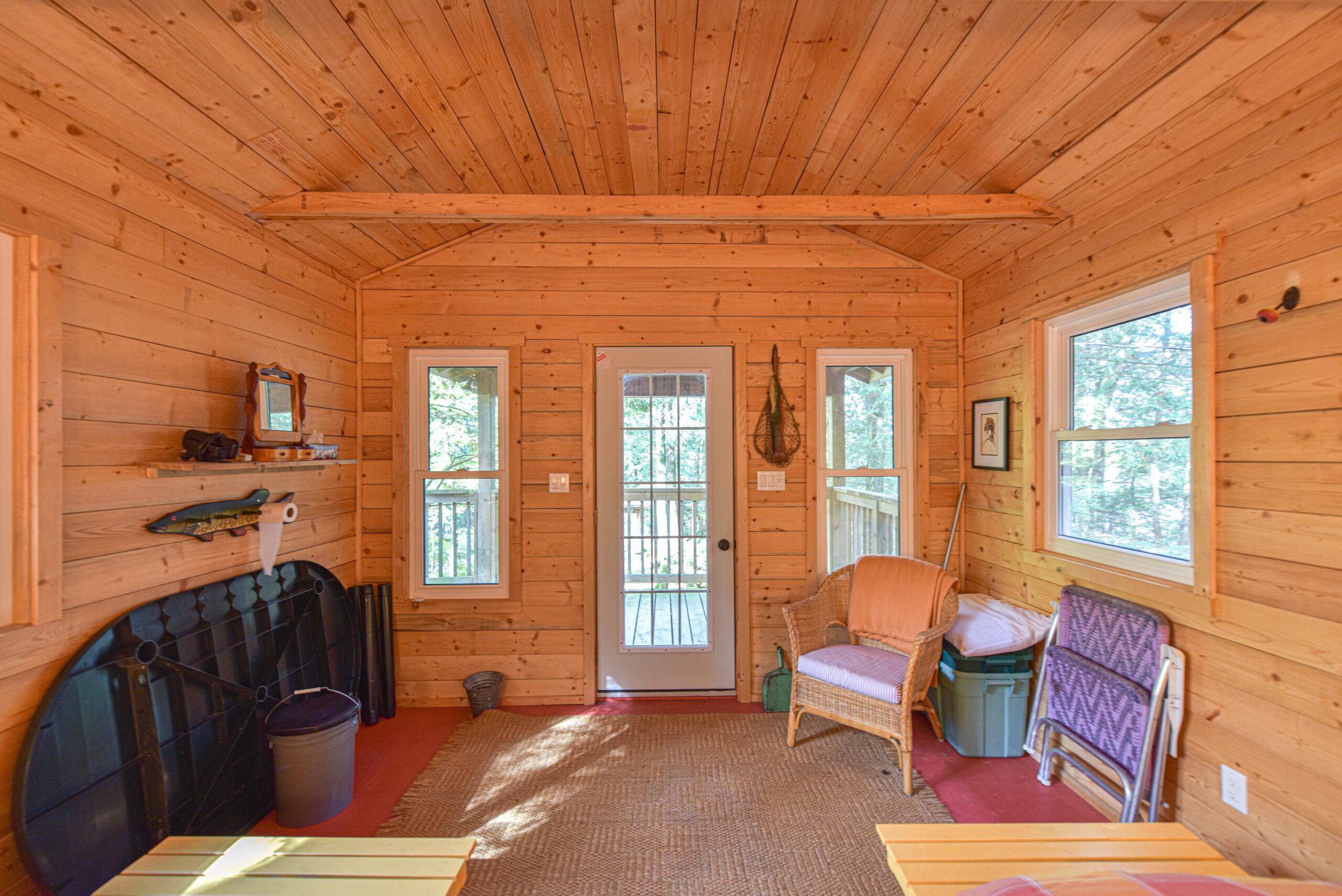 A small seating area in a pale wood panelled room