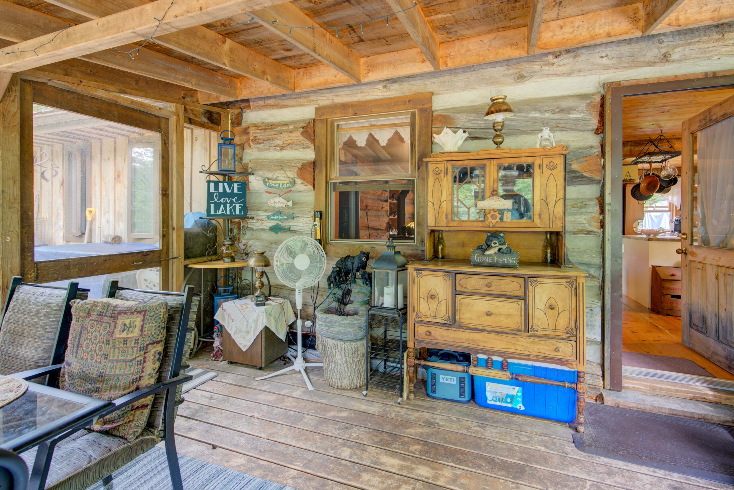 A wood-paneled room with wood cabinets and shelves