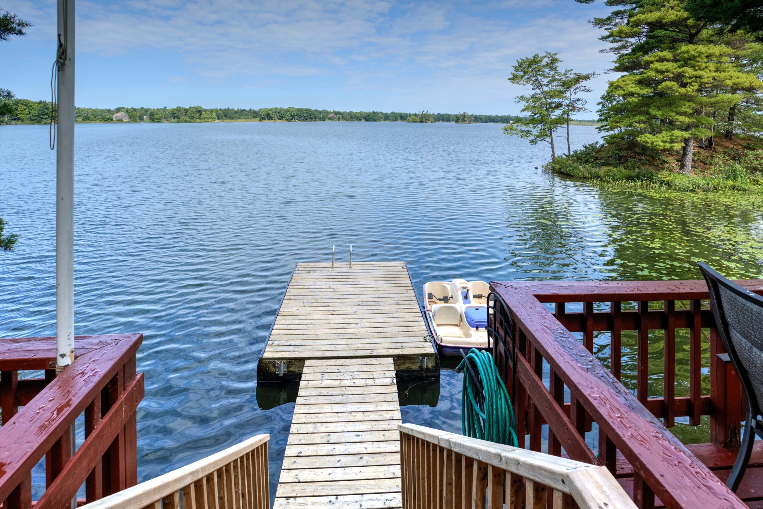 A long wood dock juts out into the water