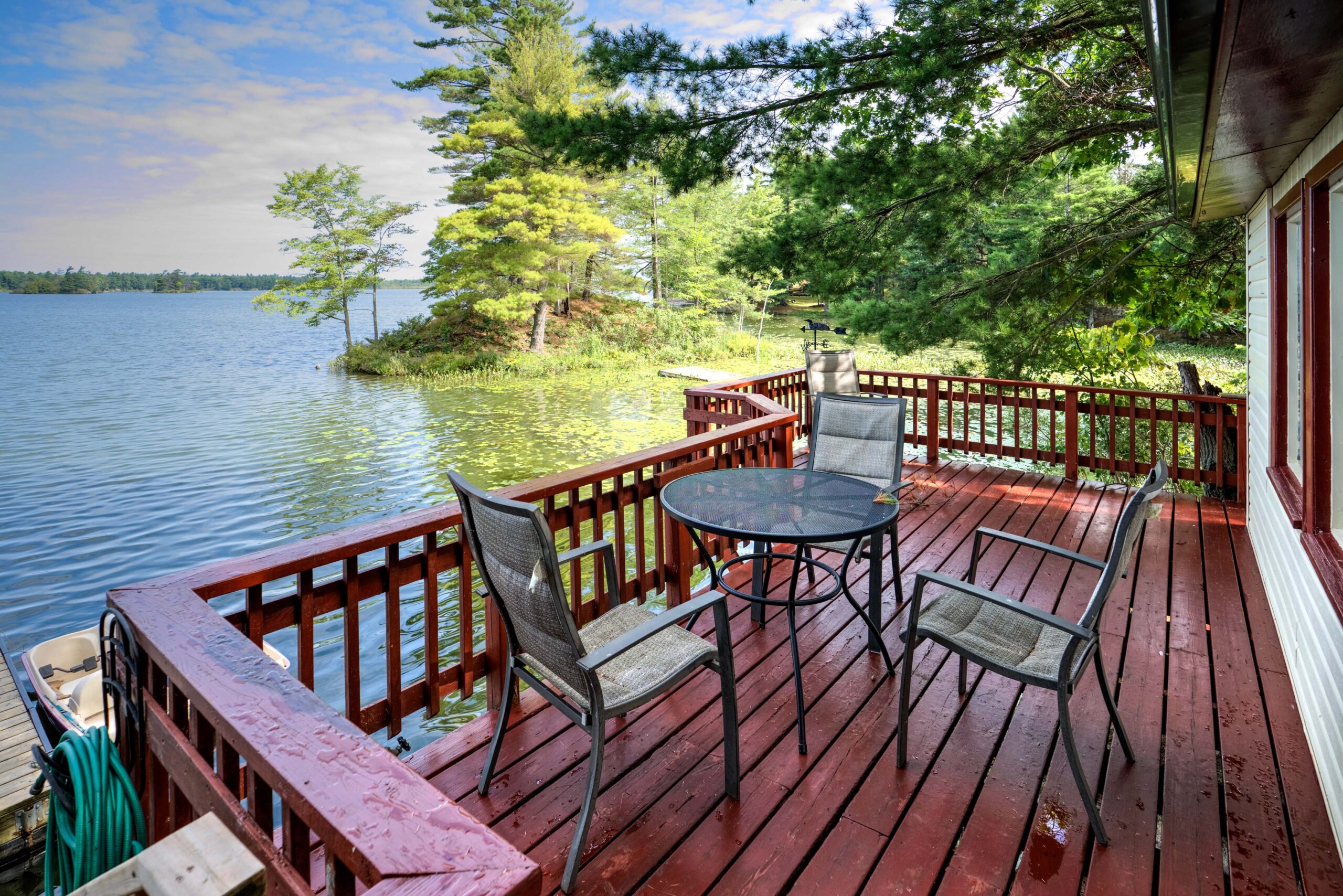 A small sitting area on the lakeside red deck