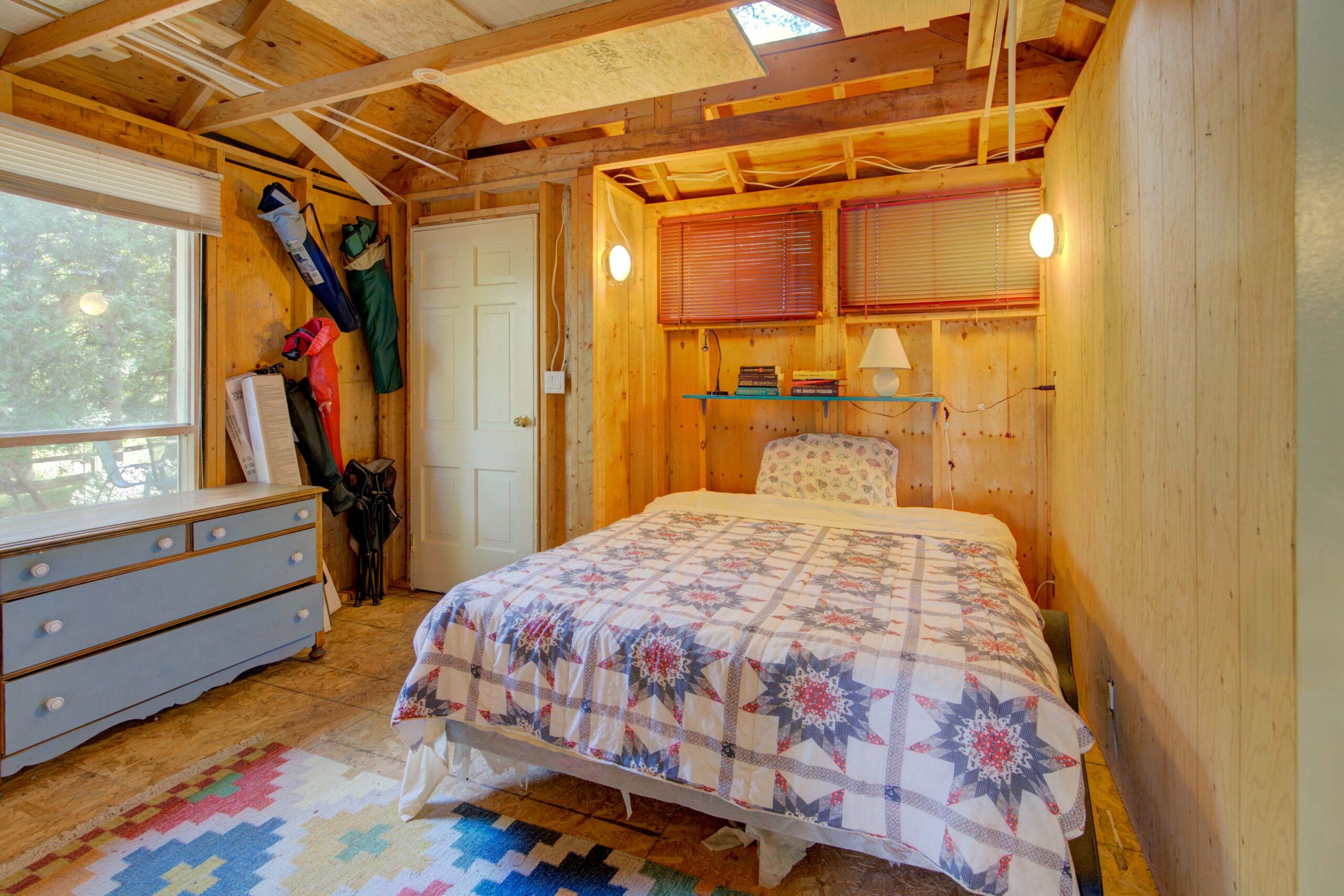 A patterned bed in a wood room