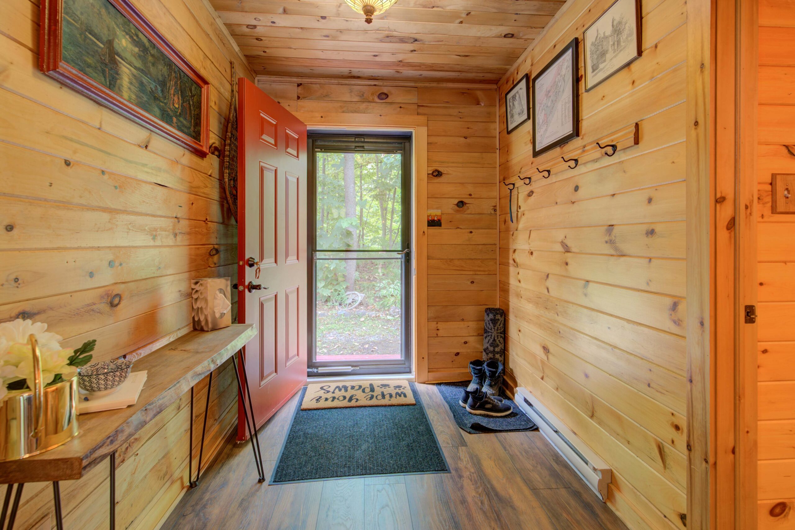 An open doorway into a wood-panelled hallway