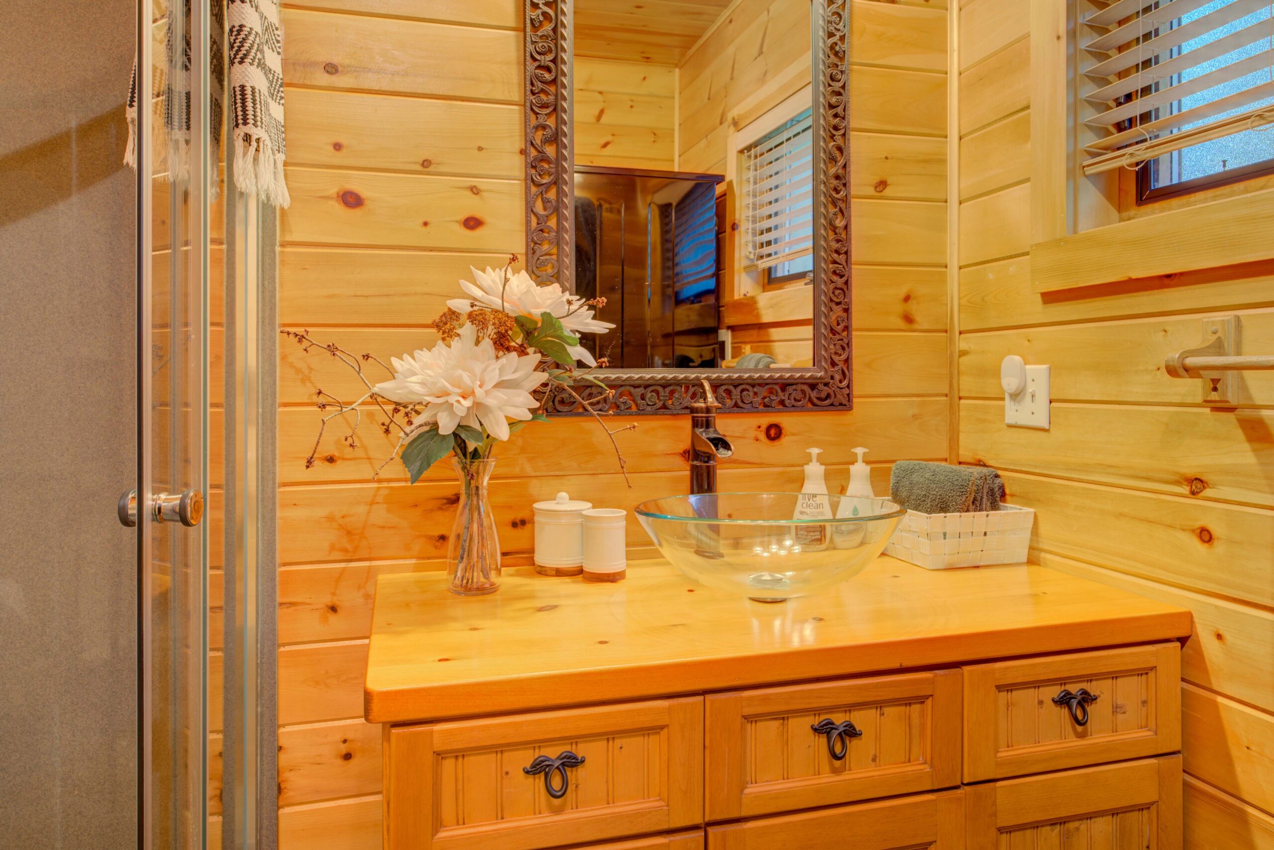 Wood vanity with a mirror above