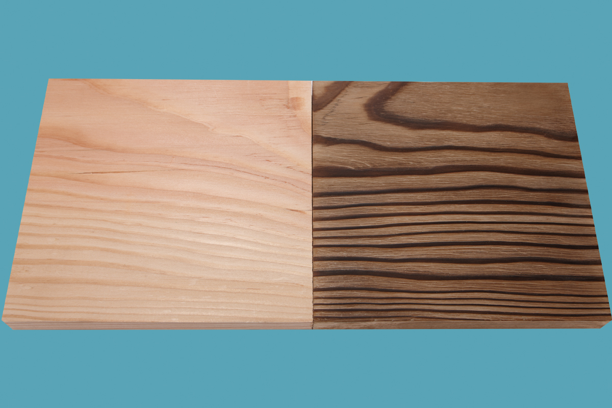 A board that's been partially burned to mimic years of wear.