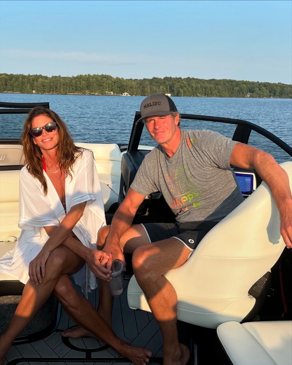 a photo of cindy crawford and rande gerber in a boat