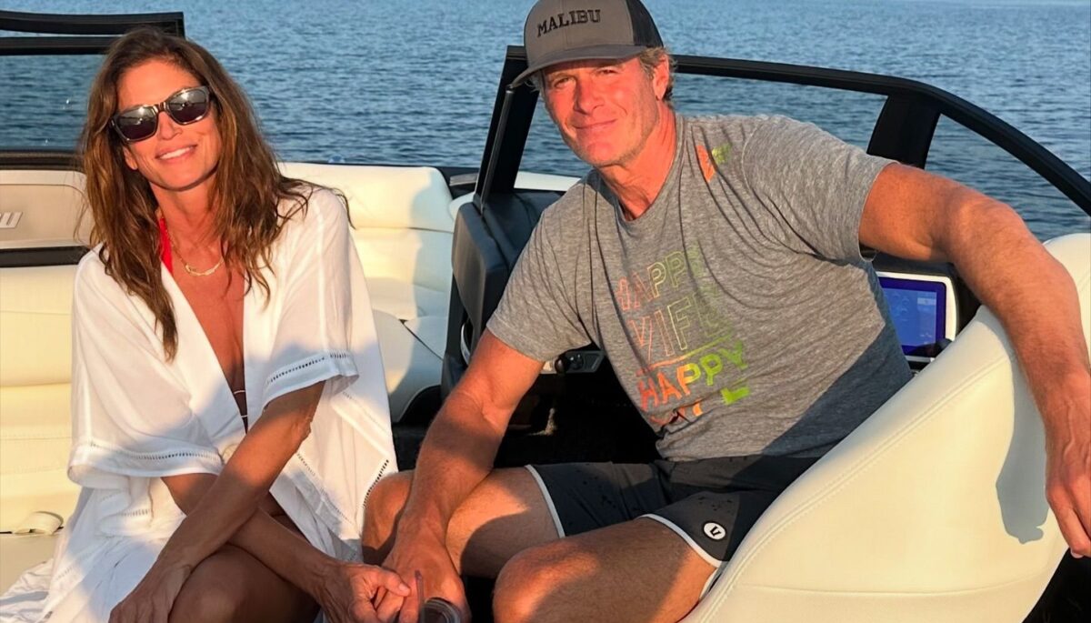 a photo of cindy crawford and rande gerber in a boat